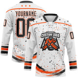 Custom White Black-Orange Stars Paint Splatter Brush Stroke Lace Neck Hockey Jersey