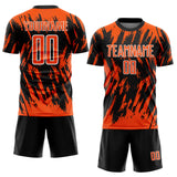 Custom Black Orange-White Splatter Torn Sharp Brush Stroke Sublimation Soccer Uniform Jersey