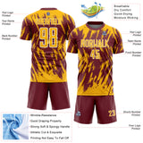 Custom Burgundy Gold-White Splatter Torn Sharp Brush Stroke Sublimation Soccer Uniform Jersey